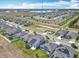 Aerial view highlighting a residential area with modern homes, solar panels, and manicured lawns at 297 Citrus Isle Loop, Davenport, FL 33837