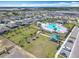 A sprawling community aerial view, with a pool, clubhouse, dog park and playground for active residents at 297 Citrus Isle Loop, Davenport, FL 33837