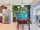 Bright dining area with decorative wall, pendant lighting and sliding glass door to the patio at 297 Citrus Isle Loop, Davenport, FL 33837