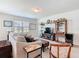 Bright living room with a comfortable sofa, stylish decor, and a large window for lots of natural light at 297 Citrus Isle Loop, Davenport, FL 33837