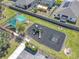 An aerial view of the community playground with state-of-the-art swings, slides and shaded areas at 297 Citrus Isle Loop, Davenport, FL 33837