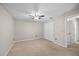 Neutral bedroom featuring neutral carpeting, a double closet, and white walls at 3093 S Horizon Pl, Oviedo, FL 32765