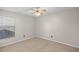 Bright bedroom featuring neutral carpeting, large windows, and a modern ceiling fan at 3093 S Horizon Pl, Oviedo, FL 32765