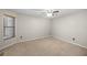 Cozy bedroom featuring neutral carpeting, base molding, and a modern ceiling fan at 3093 S Horizon Pl, Oviedo, FL 32765