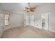 Inviting bedroom featuring plush carpet, neutral walls, and a ceiling fan for added comfort at 3093 S Horizon Pl, Oviedo, FL 32765