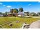 Lovely single-story home with lush lawn, enhanced by palm trees and inviting curb appeal at 3093 S Horizon Pl, Oviedo, FL 32765