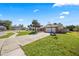 Charming single-story home with a well-manicured lawn, a basketball hoop and ample parking space at 3093 S Horizon Pl, Oviedo, FL 32765