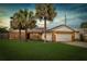 Beautiful single-story brick home with a lush green lawn and solar panels in the roof at 3093 S Horizon Pl, Oviedo, FL 32765