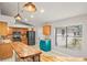 Bright kitchen featuring wooden cabinetry, stainless steel appliances, and a window offering natural light at 3093 S Horizon Pl, Oviedo, FL 32765