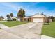 A well-maintained single-story home with brick facade, palm trees, and a two-car garage at 3093 S Horizon Pl, Oviedo, FL 32765