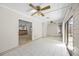 Sunroom featuring tile flooring, paneled ceilings, and a view of the dining area at 3093 S Horizon Pl, Oviedo, FL 32765