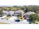 Aerial view of a suburban home with a well-maintained lawn and a two-car garage at 321 Cape Sable Dr, Orlando, FL 32825