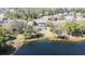 Backyard featuring a screened pool facing a serene lake at 321 Cape Sable Dr, Orlando, FL 32825