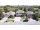 Aerial view of a three-car garage home in a well-maintained neighborhood at 321 Cape Sable Dr, Orlando, FL 32825