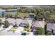 Suburban homes featuring mature trees and a peaceful lake view at 321 Cape Sable Dr, Orlando, FL 32825