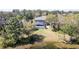 Backyard featuring a screened pool facing a serene lake at 321 Cape Sable Dr, Orlando, FL 32825