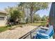 Brick patio and a firepit area for outdoor gatherings and relaxation overlooking a tranquil lake at 321 Cape Sable Dr, Orlando, FL 32825