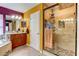 This bathroom showcases a tiled shower, dual sinks, and granite counters at 321 Cape Sable Dr, Orlando, FL 32825