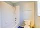 Functional bathroom with a shower-tub combination, toilet, and blue-painted walls at 321 Cape Sable Dr, Orlando, FL 32825