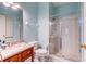 Bright bathroom featuring a glass enclosed shower, marble countertop vanity, and a toilet at 321 Cape Sable Dr, Orlando, FL 32825