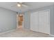 Cozy bedroom with tile floors, ceiling fan, and a double door closet at 321 Cape Sable Dr, Orlando, FL 32825