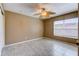 A bedroom featuring neutral paint, tile flooring, a ceiling fan and a window for plenty of natural light at 321 Cape Sable Dr, Orlando, FL 32825