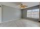Comfortable bedroom with a decorative fan, a large window, and tile flooring at 321 Cape Sable Dr, Orlando, FL 32825