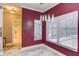 Dining room featuring textured walls, modern light fixture, and bright windows at 321 Cape Sable Dr, Orlando, FL 32825