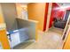 Hallway with tile flooring leading to the media room and the stairs, showcasing the home's layout at 321 Cape Sable Dr, Orlando, FL 32825