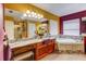 The main bathroom features dual sinks, soaking tub, and a seamless glass shower at 321 Cape Sable Dr, Orlando, FL 32825