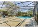 Enjoy the screened pool and tranquil lake views from this outdoor space at 321 Cape Sable Dr, Orlando, FL 32825