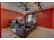 Home theater room featuring tiered seating with leather recliners, dark curtains and track lighting at 321 Cape Sable Dr, Orlando, FL 32825
