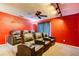 Home theater with tiered seating, plush leather recliners, and dark curtains at 321 Cape Sable Dr, Orlando, FL 32825