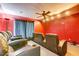 Home theater with tiered seating, plush leather recliners, and a ceiling fan at 321 Cape Sable Dr, Orlando, FL 32825
