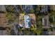 Aerial view of a home with a gray roof surrounded by mature trees and lush landscaping at 321 Ferdinand Dr, Longwood, FL 32750