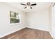 Bedroom with hardwood flooring, bright window, and ceiling fan at 321 Ferdinand Dr, Longwood, FL 32750