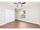 Bedroom features hardwood flooring, closet, and bright window view at 321 Ferdinand Dr, Longwood, FL 32750