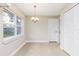 Bright dining area with tiled flooring, a modern chandelier, and an exterior window at 321 Ferdinand Dr, Longwood, FL 32750