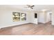 Spacious living room featuring light wood floors and a bright window to the neighborhood at 321 Ferdinand Dr, Longwood, FL 32750