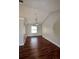 Dining room with hard wood floors, neutral paint, vaulted ceiling and modern light fixture at 3548 Picciola Cutoff Rd, Fruitland Park, FL 34731