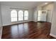 Bright living room featuring hardwood floors, neutral paint, and large windows at 3548 Picciola Cutoff Rd, Fruitland Park, FL 34731