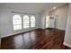 Bright living room featuring hardwood floors, neutral paint, and large windows at 3548 Picciola Cutoff Rd, Fruitland Park, FL 34731