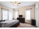 Bedroom with a ceiling fan, plenty of natural light, television, and closet at 3605 Conroy Rd # 537, Orlando, FL 32839