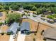 Aerial perspective of a single-Gathering house with a fenced backyard, located in a quiet residential neighborhood at 4458 Goldenrain Ct, Orlando, FL 32808