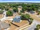 Drone shot showcasing a property with a fenced yard and beautiful landscape, surrounded by nature at 4458 Goldenrain Ct, Orlando, FL 32808