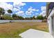 Expansive backyard with a white block wall, offering ample space for outdoor activities and customization at 4458 Goldenrain Ct, Orlando, FL 32808