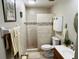 Clean bathroom featuring a tiled walk-in shower, vanity with sink, and tiled floors at 482 Windmeadows St # 482, Altamonte Springs, FL 32701