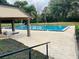 Community pool area boasts shaded seating, a gazebo, and lush landscaping for outdoor enjoyment at 482 Windmeadows St # 482, Altamonte Springs, FL 32701