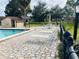 Community pool area features lounge chairs, tables, and a shaded gazebo for residents' enjoyment at 482 Windmeadows St # 482, Altamonte Springs, FL 32701