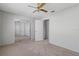 Bedroom featuring neutral carpet and closet with mirrored doors at 4825 Lighthouse Cir # 4825, Orlando, FL 32808